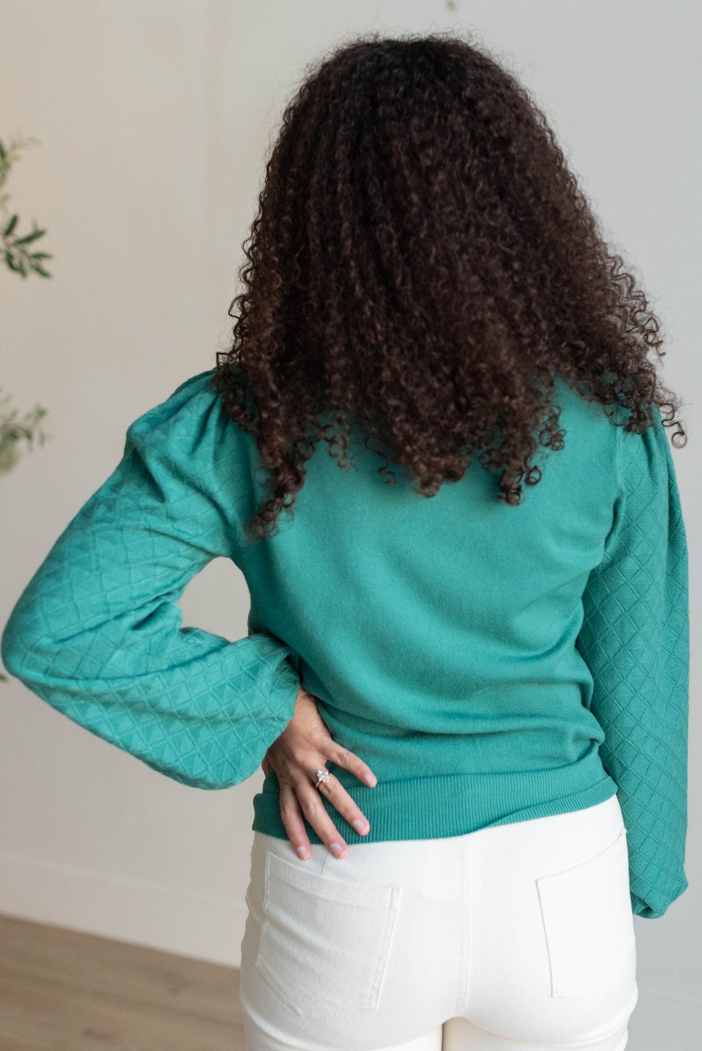 Back view of the green textured sweater