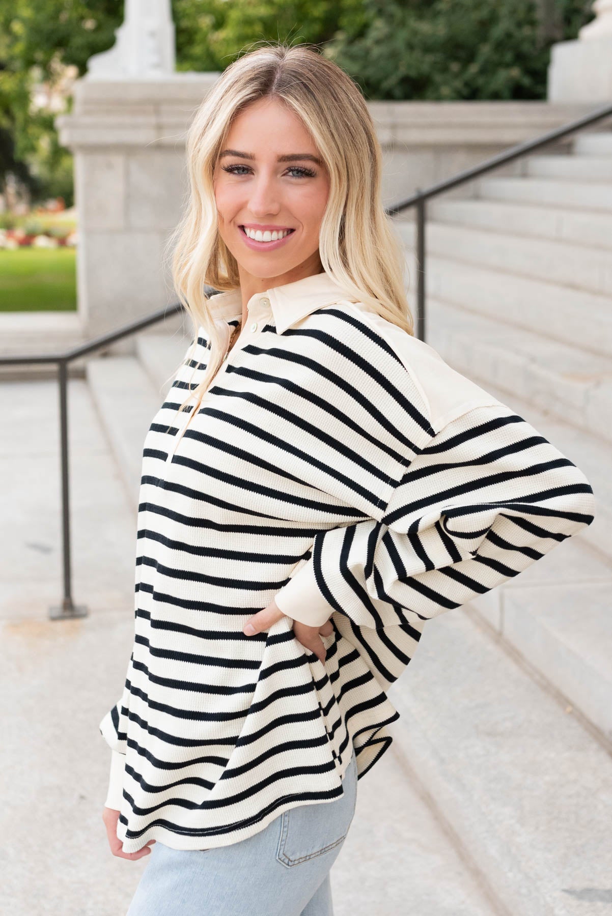 Side view of the black stripe pullover shirt