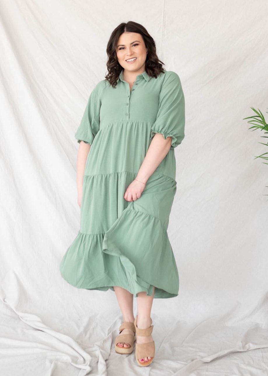 Plus size green collared tiered dress with buttons on the bodice