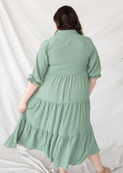 Back view of the green collared tiered dress in plus size