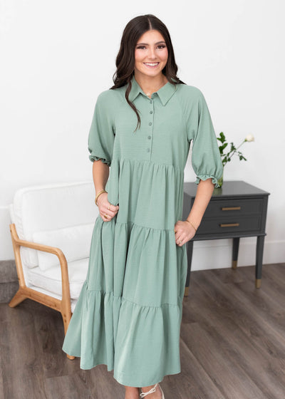 Button up bodice on the green collared tiered dress