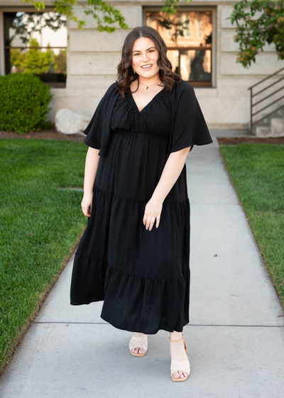 Deep v-neck plus size black tiered maxi dress