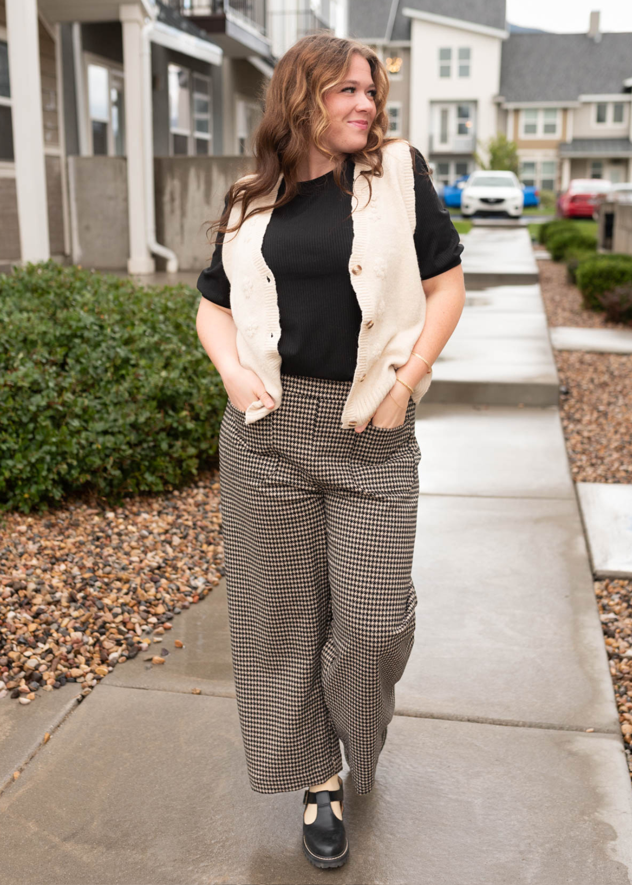 Plus size black houndstooth pants with wide legs and front pockets