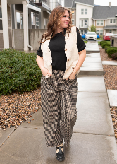 Plus size black houndstooth pants with wide legs and front pockets