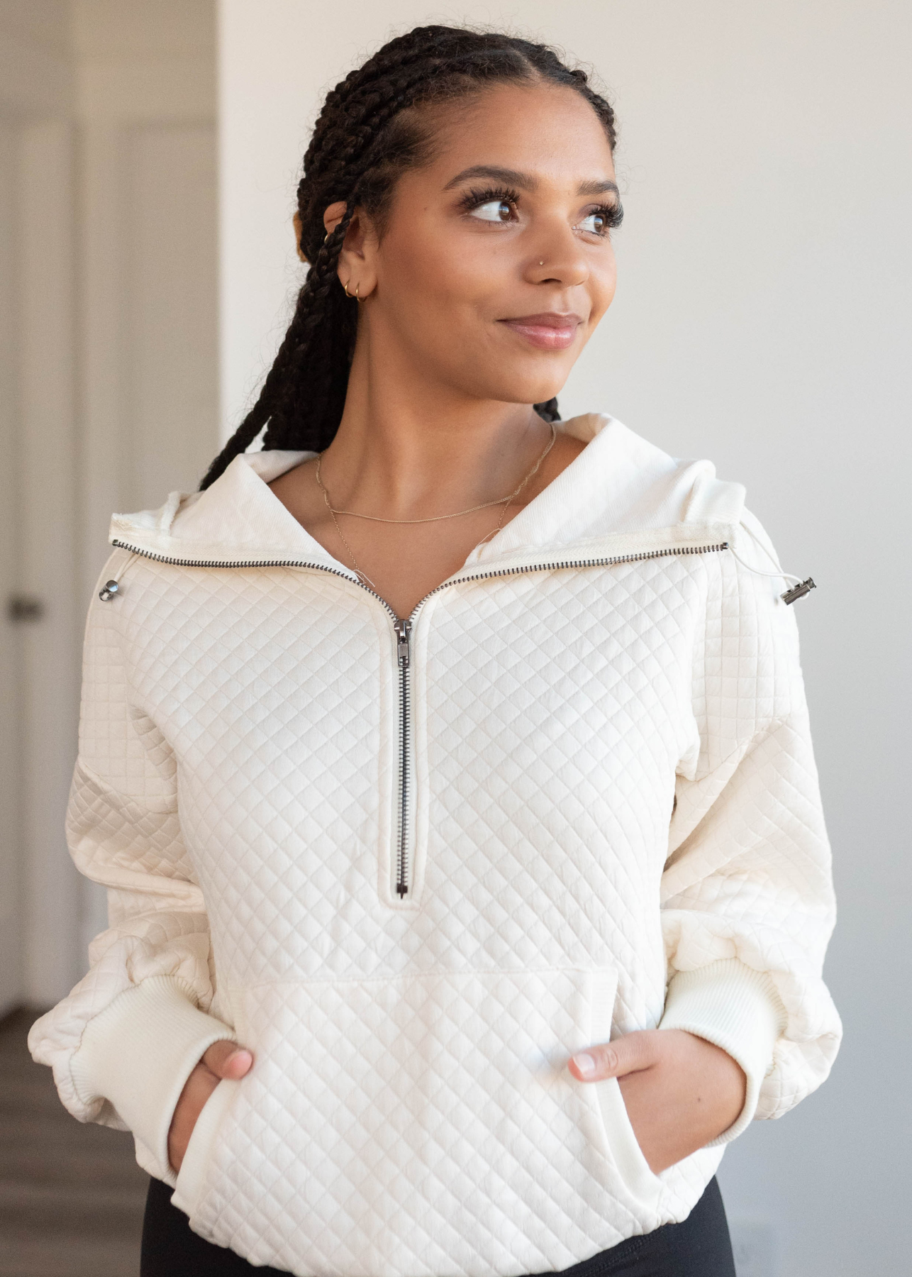 Cream quilted half zip pullover with front pocket