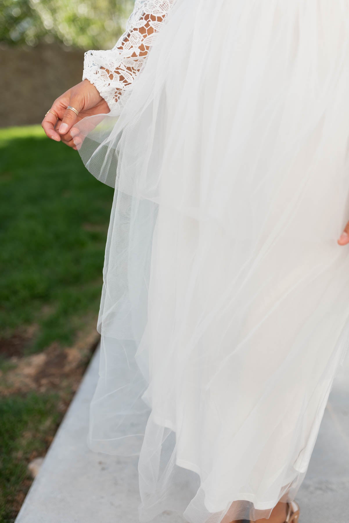 Close up of the tulle skirt on the white lace tulle dress