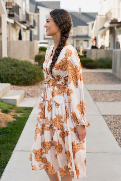 Side view of the beige floral dress