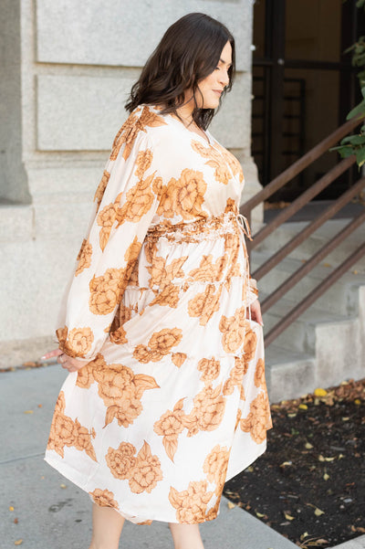 Side view of the beige floral dress in plus size