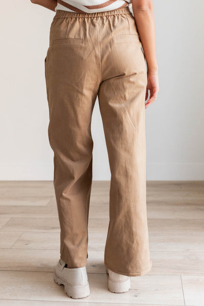 Back view of the tan wide leg pant with back elastic waist band