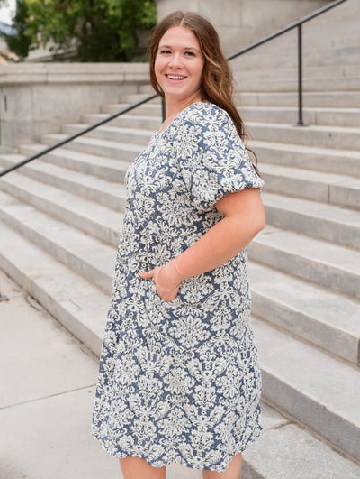 Side view of the navy multi floral dress in plus size