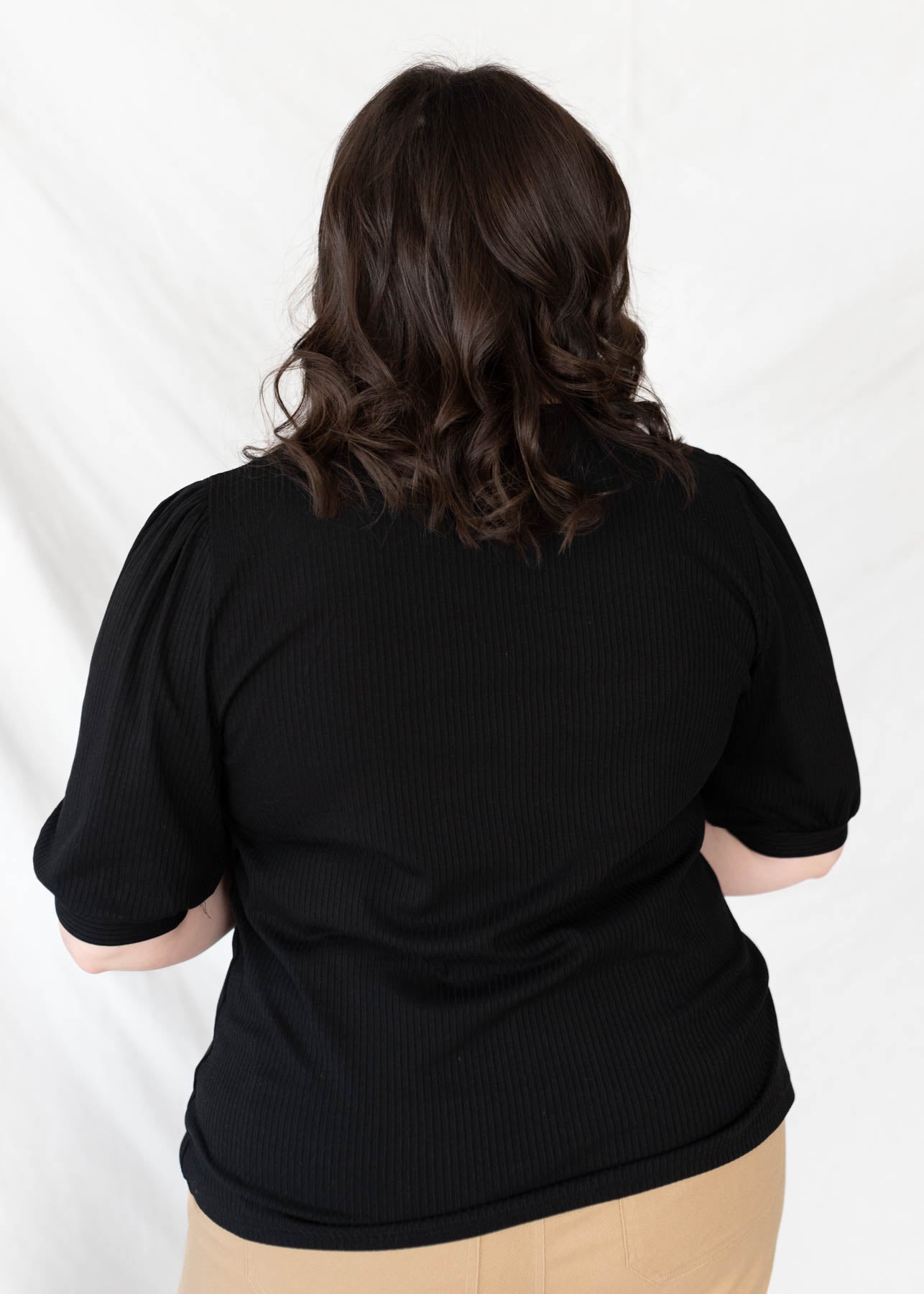 Back view of the basic black top in plus size