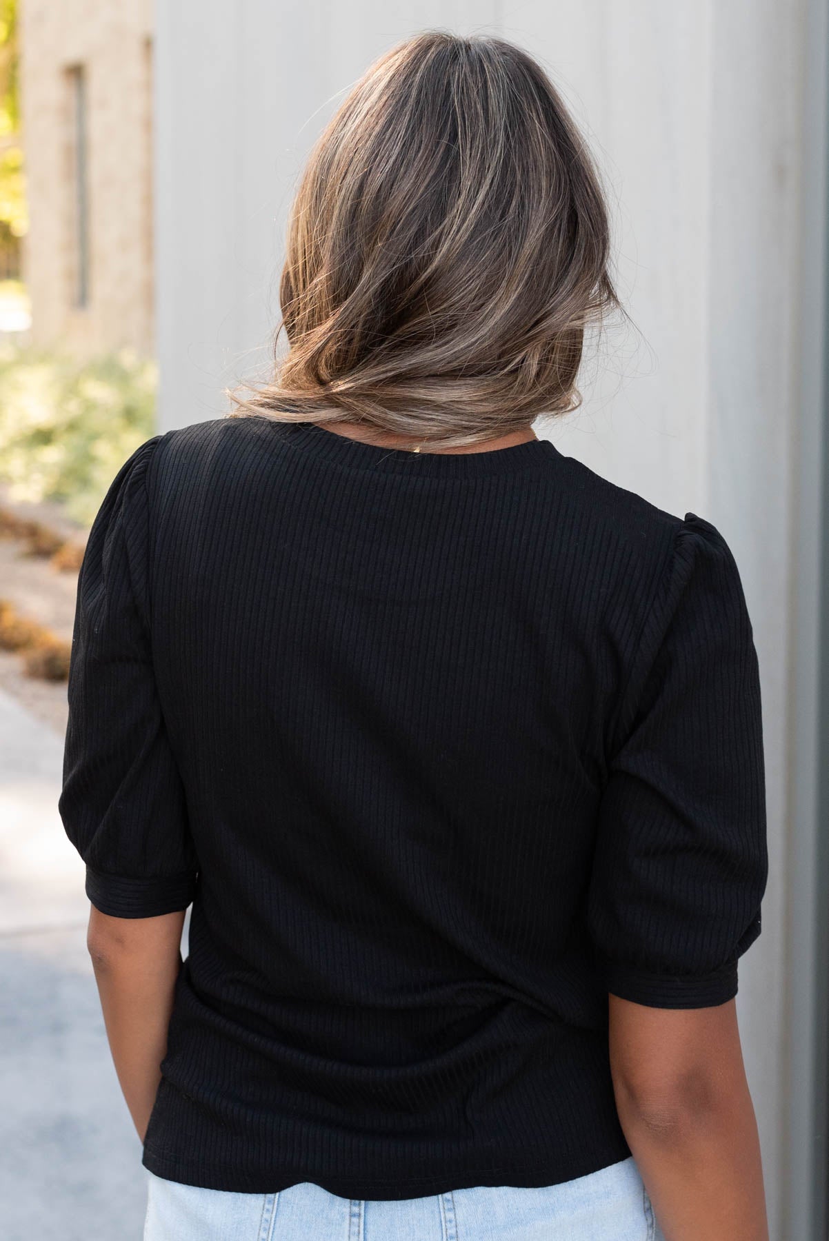 Back view of the basic black top in small