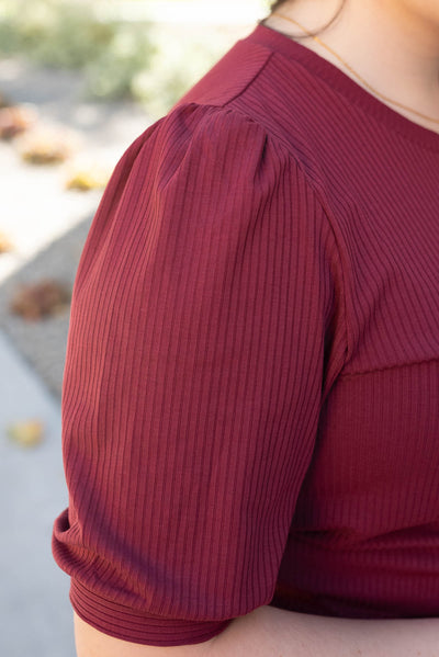 Close up of the sleeve on the basic burgundy top