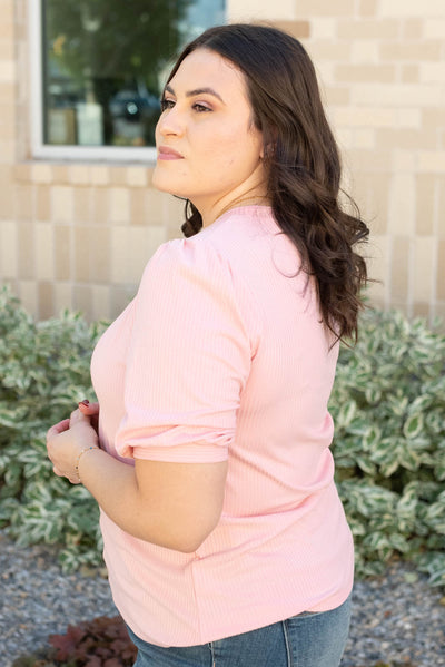 Side view of the plus size basic pink top