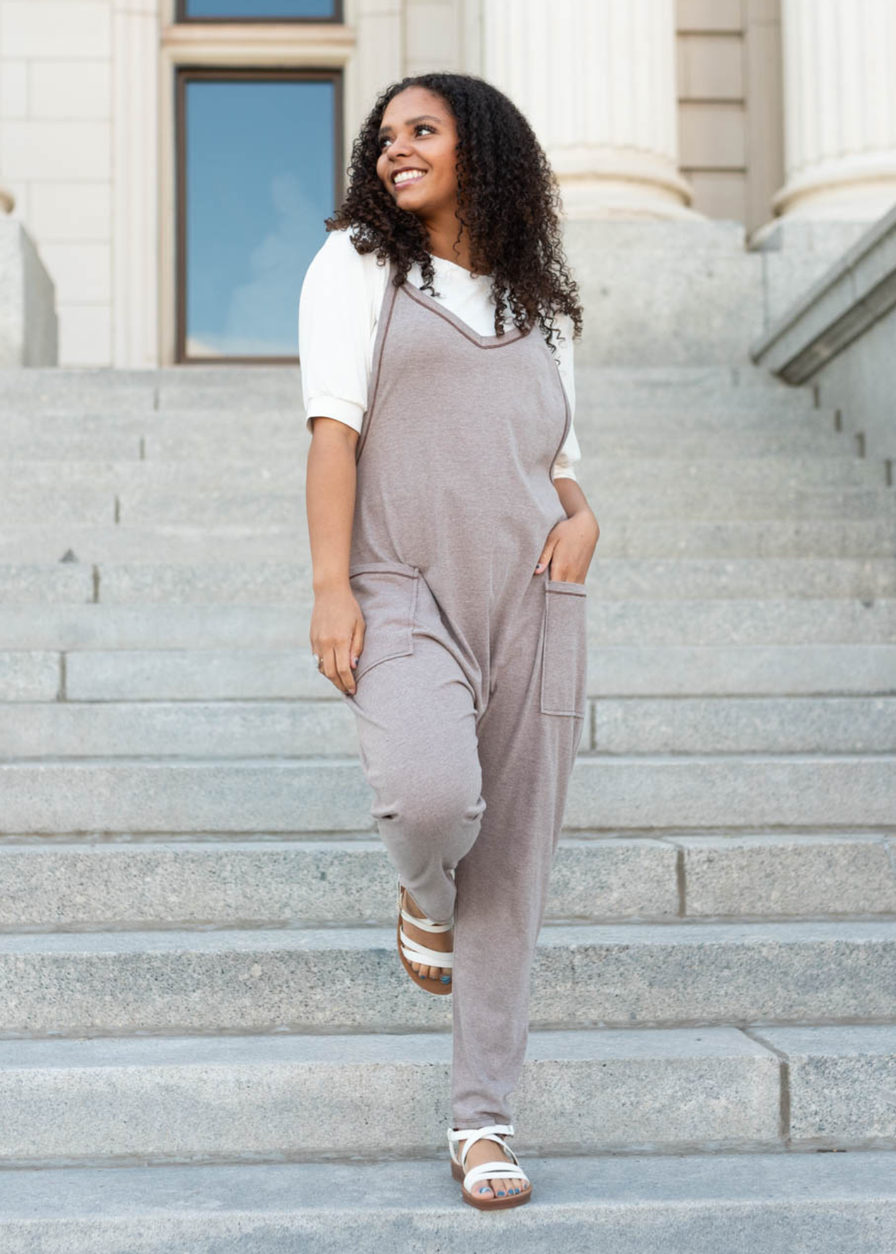 Basic white top under a taupe jumpsuit