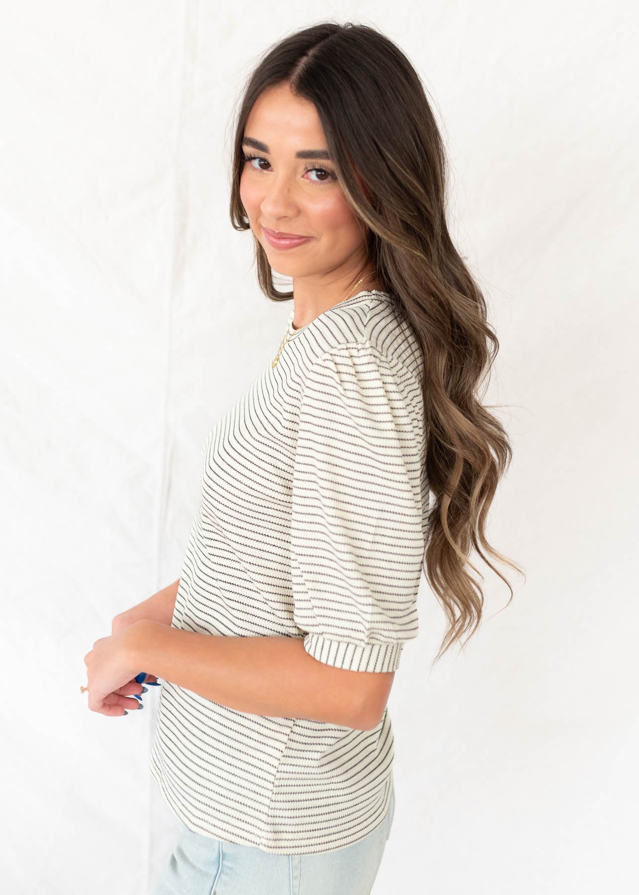 Side view of the ivory striped top