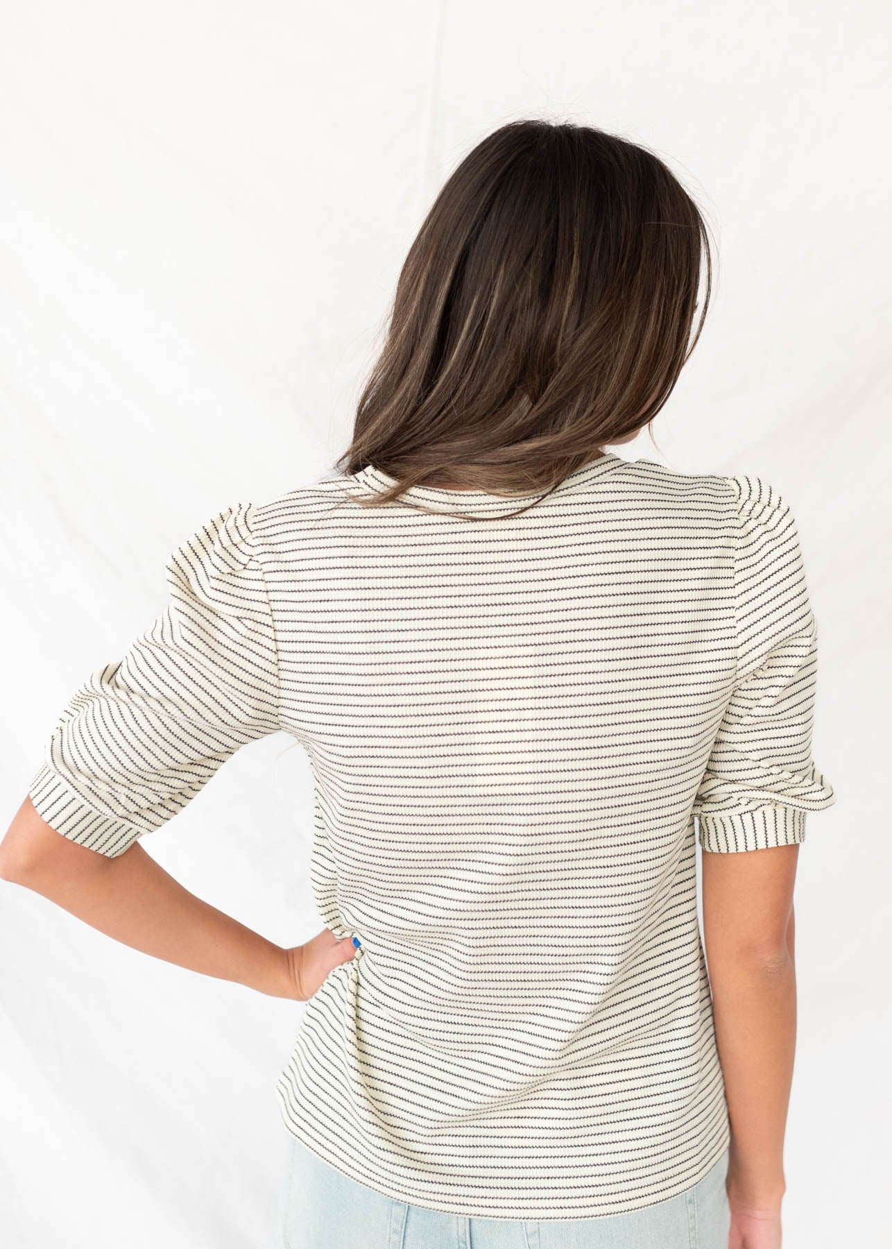 Back view of the ivory striped top