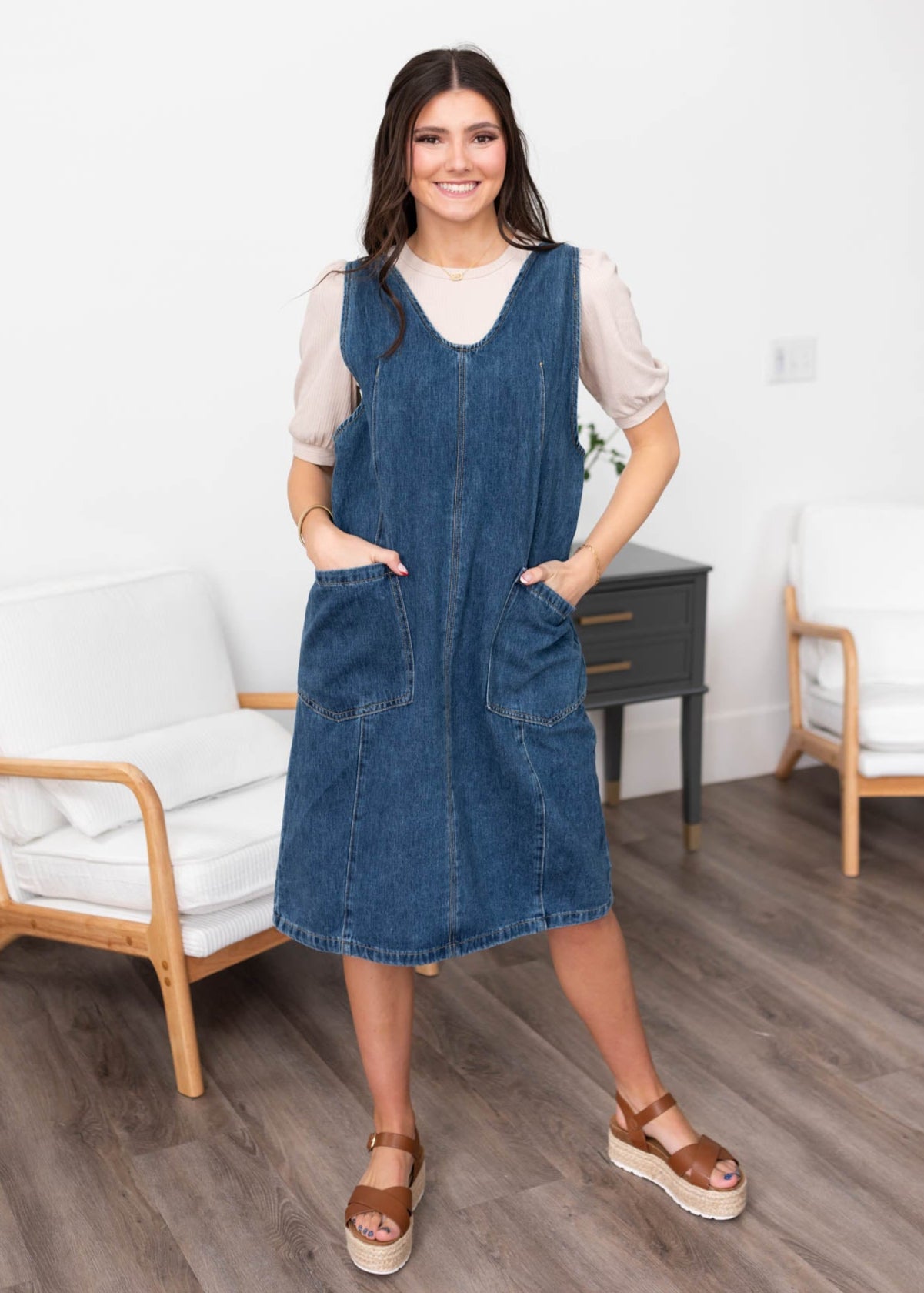 Front view of the indigo denim overall dress