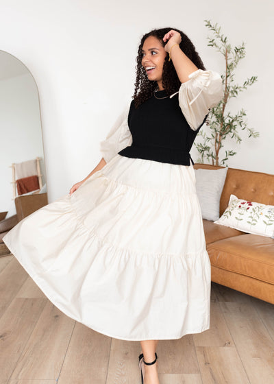 Ivory sleeves and skirt on the black sweater vest dress