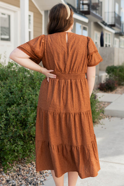 Back view of the chestnut ruffle tiered dress in plus size