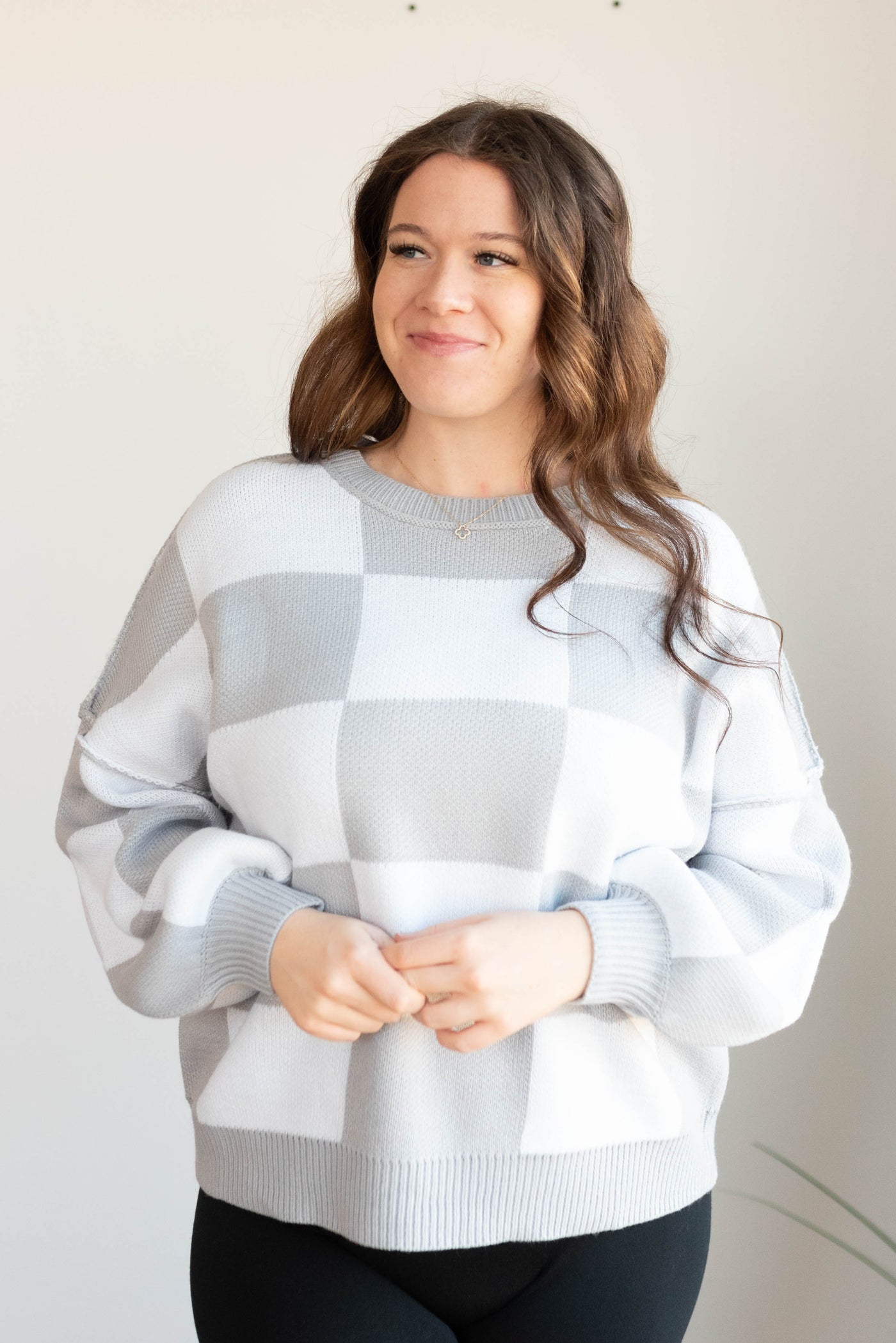 Plus size gray checkered sweater with long sleeves