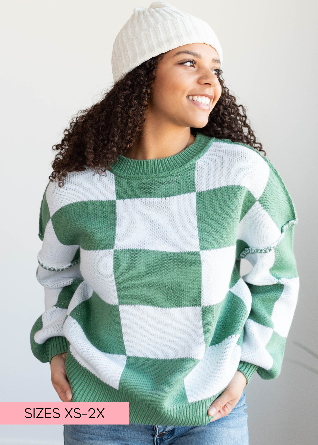 White and green checkered sweater