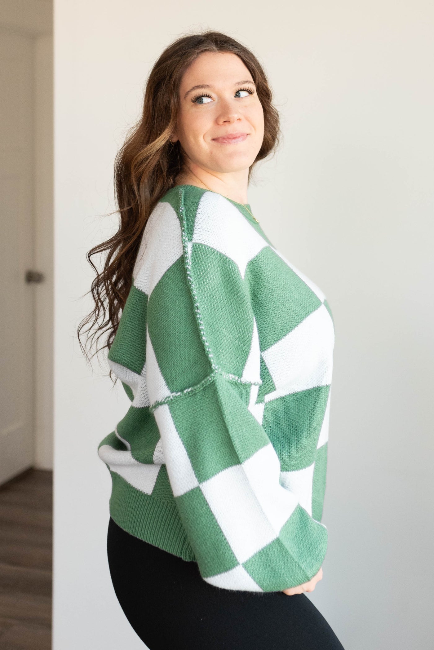 Side view of the green checkered sweater