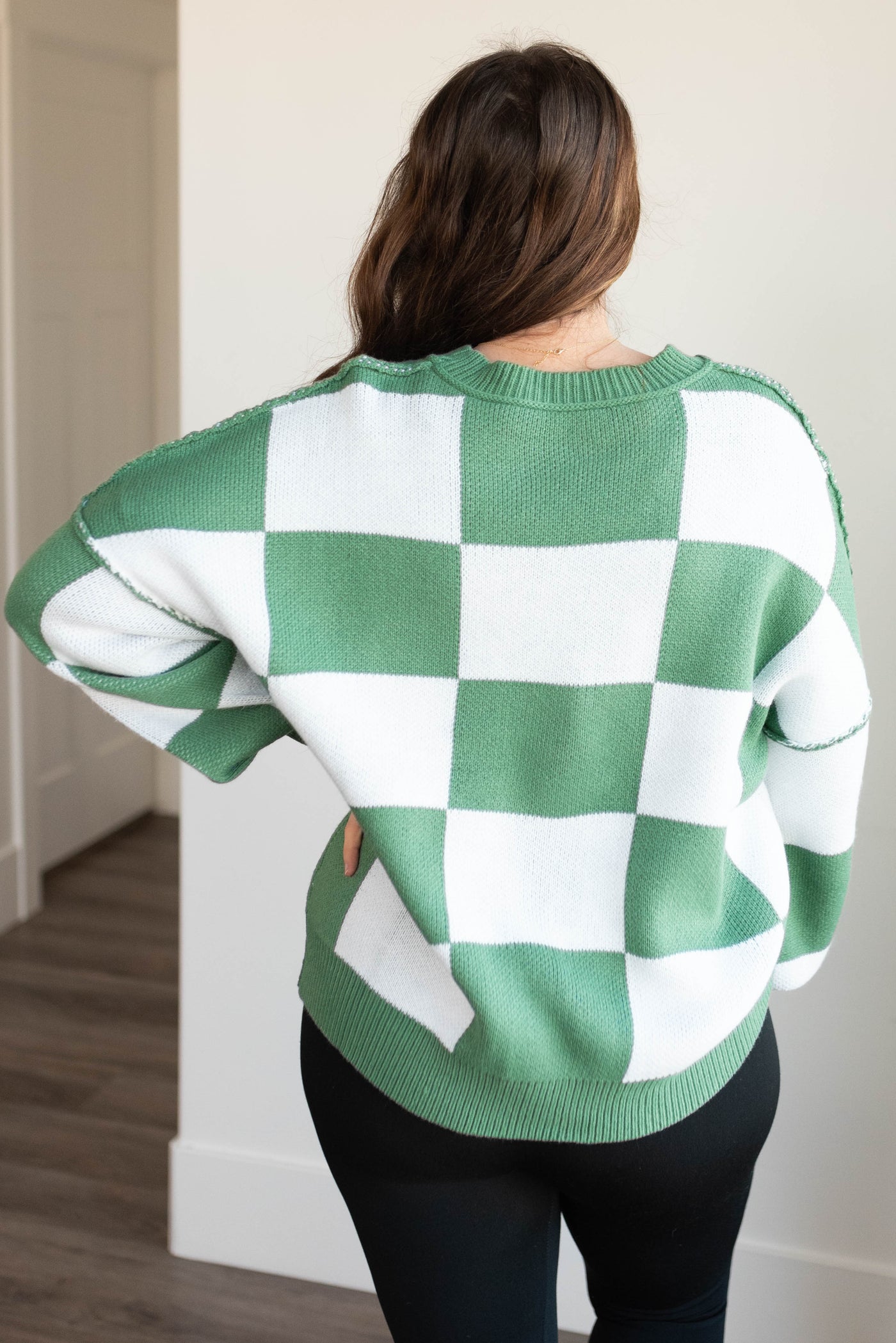 Back view of the green checkered sweater