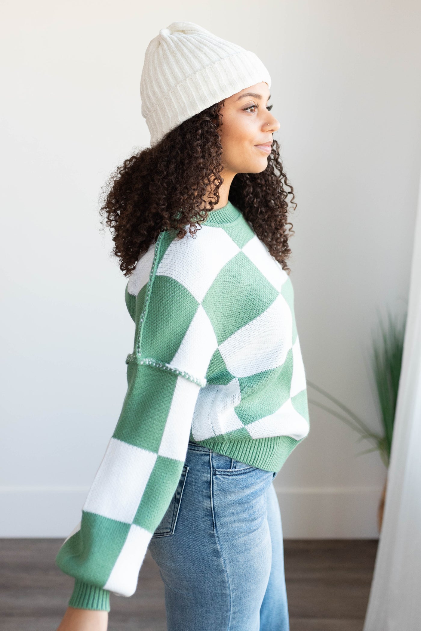 Side view of the green checkered sweater