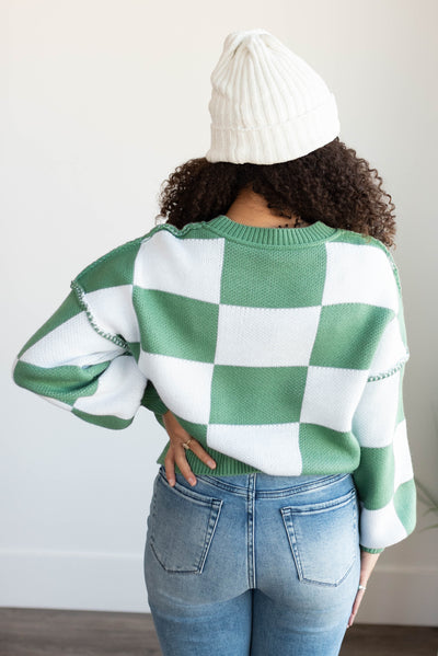 Back view of the green checkered sweater