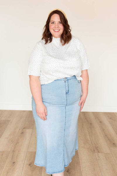 Plus size ivory floral ruffle top with short sleeves