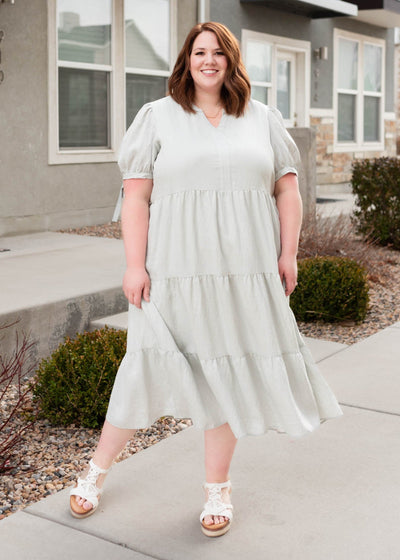 Plus size light blue tiered dress with ties on the sleeve