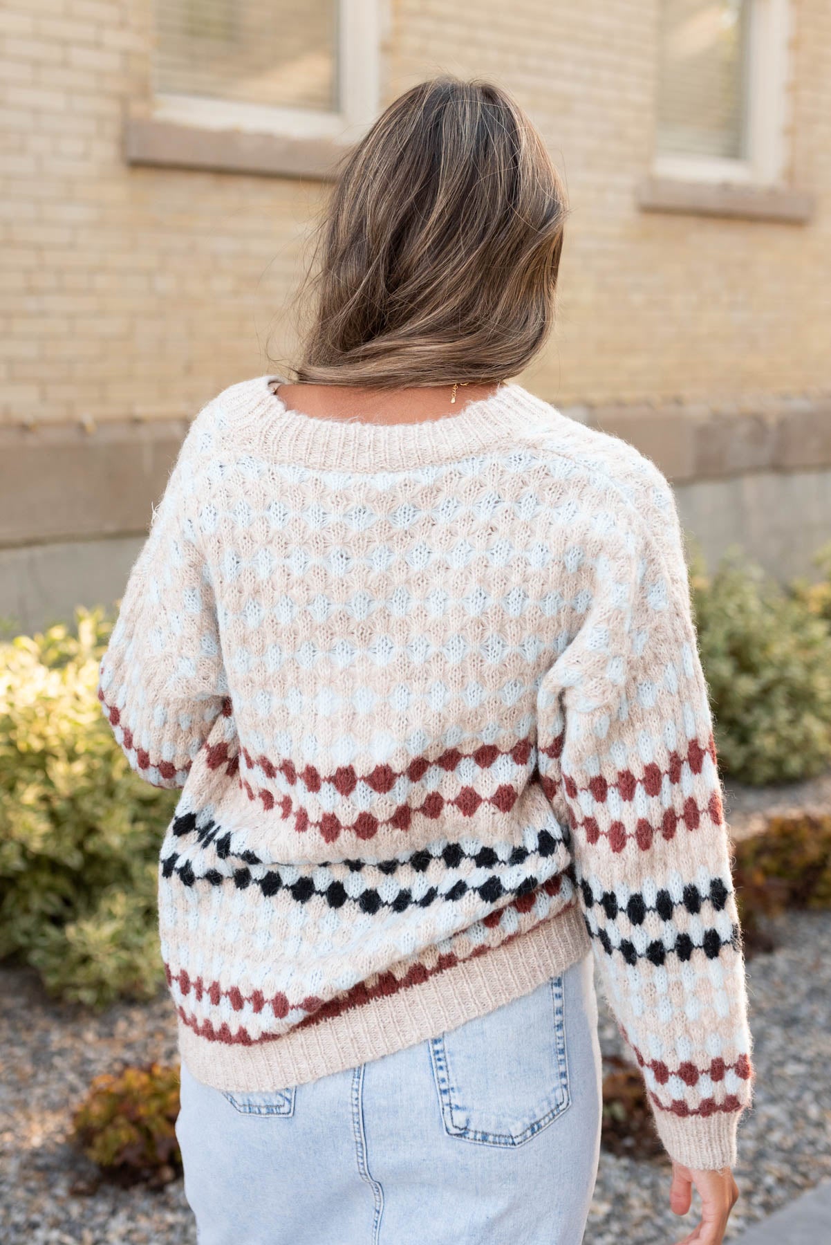 Back view of the taupe pattern cardigan