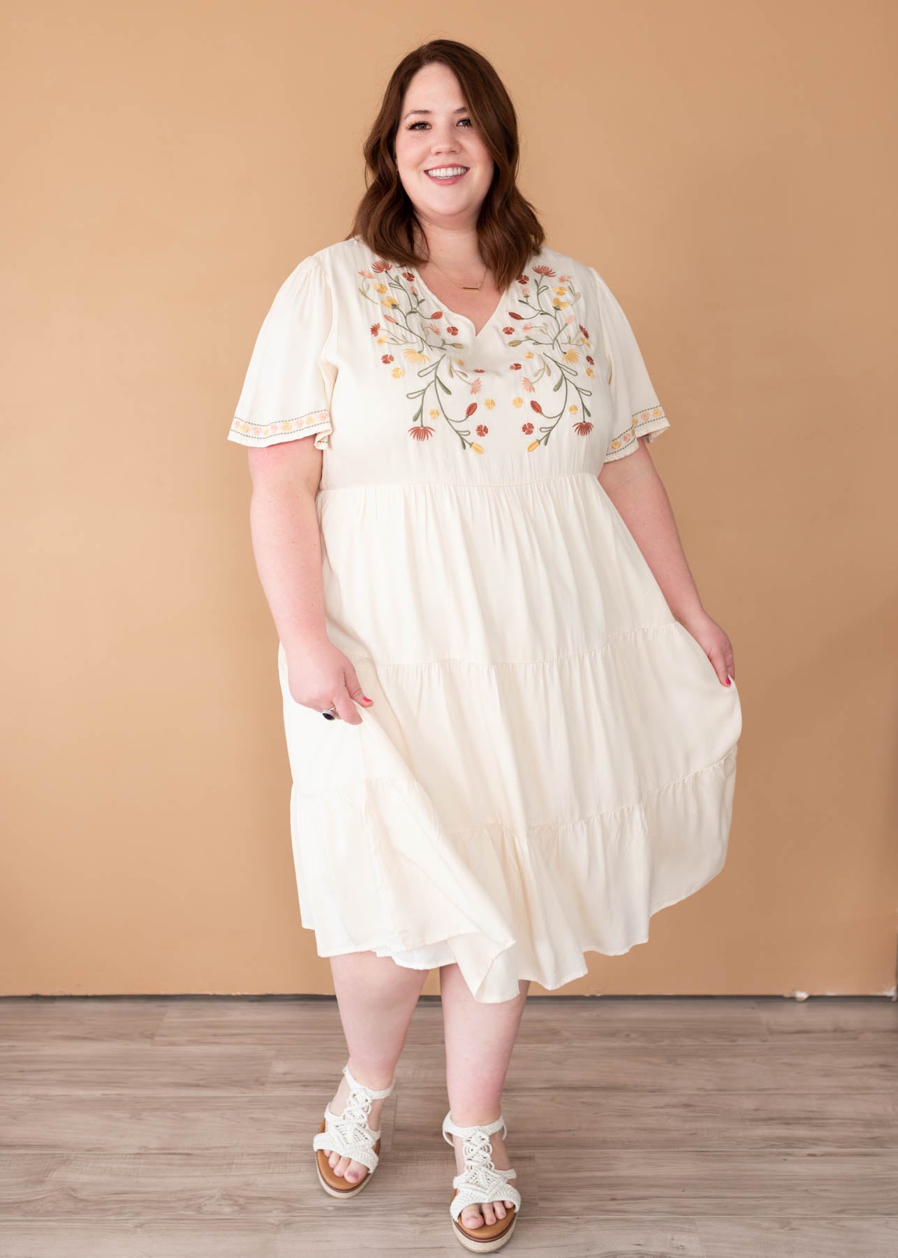 Plus size ivory embroidered tiered dress with embroidery on the bodice