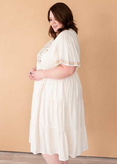 Side view of the ivory embroidered tiered dress in plus size