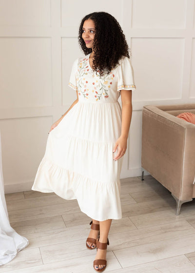 Ivory embroidered tiered dress with embroidery on the sleev and bodice