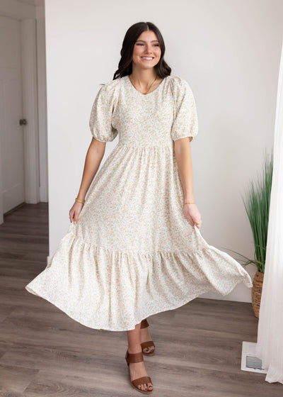 Orange floral dress with wide ruffle at the hem