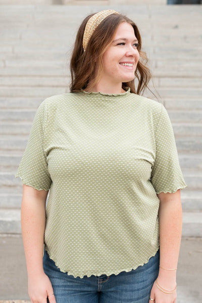 Front view of the olive dot texture top