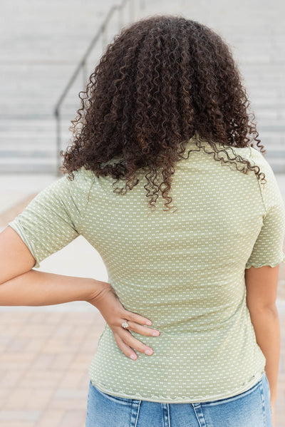 Back view of the olive dot texture top