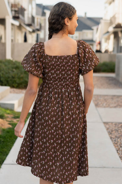 Back view of the brown floral dress