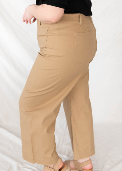 Side view of the taupe wide leg pants in plus size