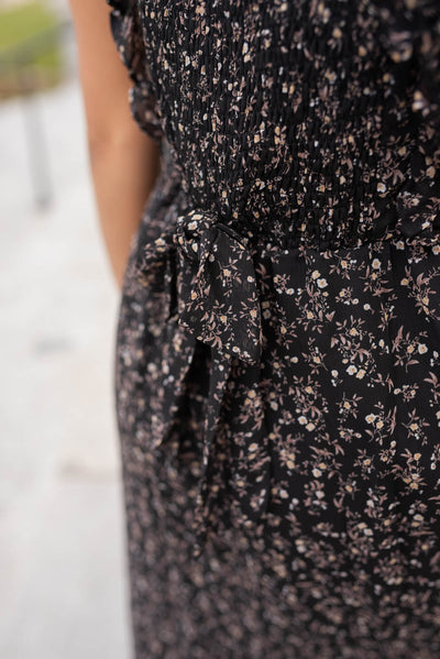 Close up of the back of the dress on the black floral dress