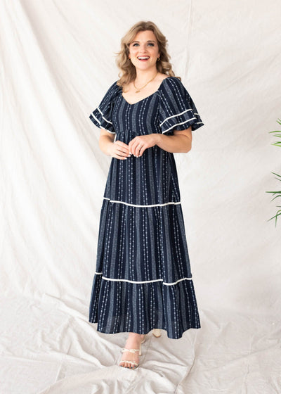 Navy floral pattern dress with white trim on the sleeves and skirt