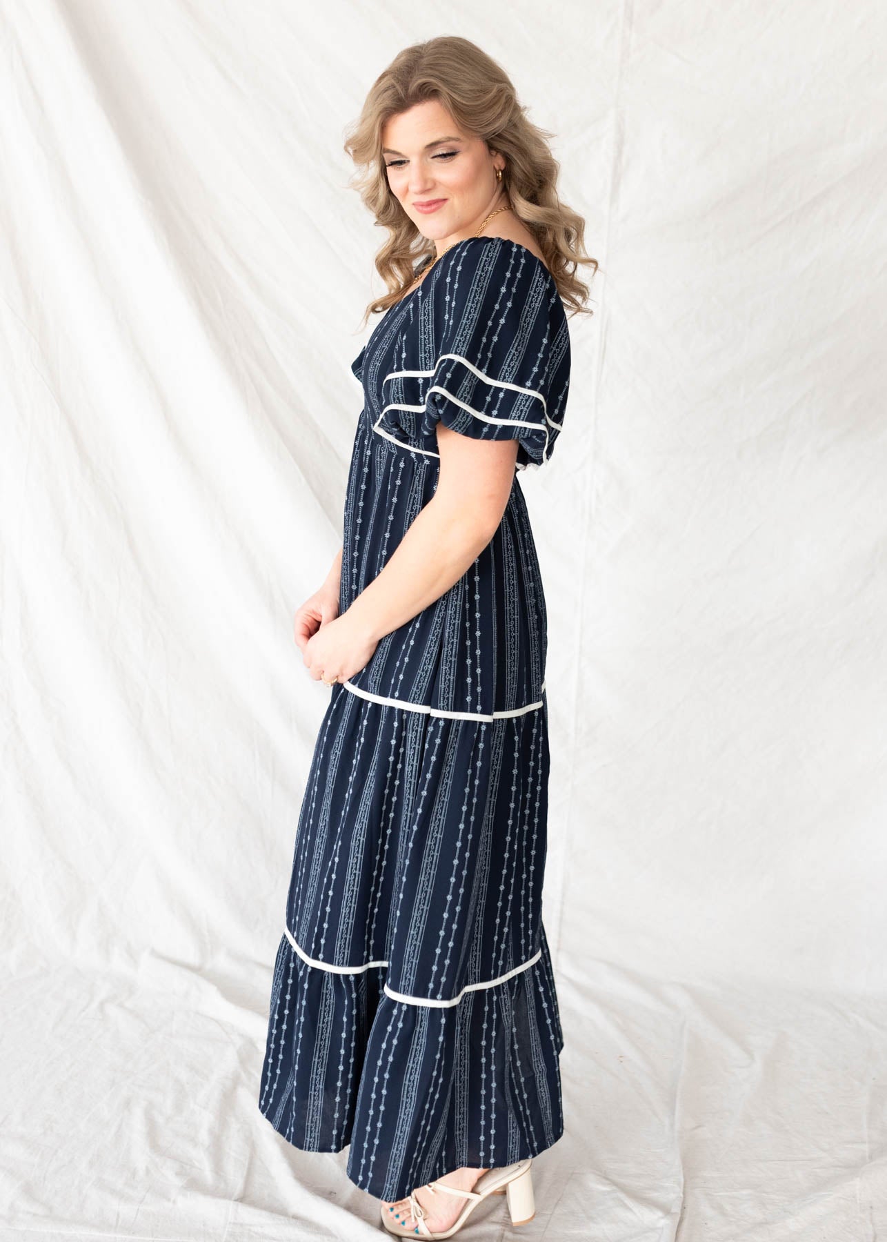 Side view of the navy floral pattern dress