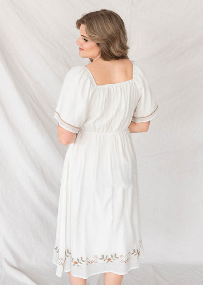 Back view of the white embroidered dress