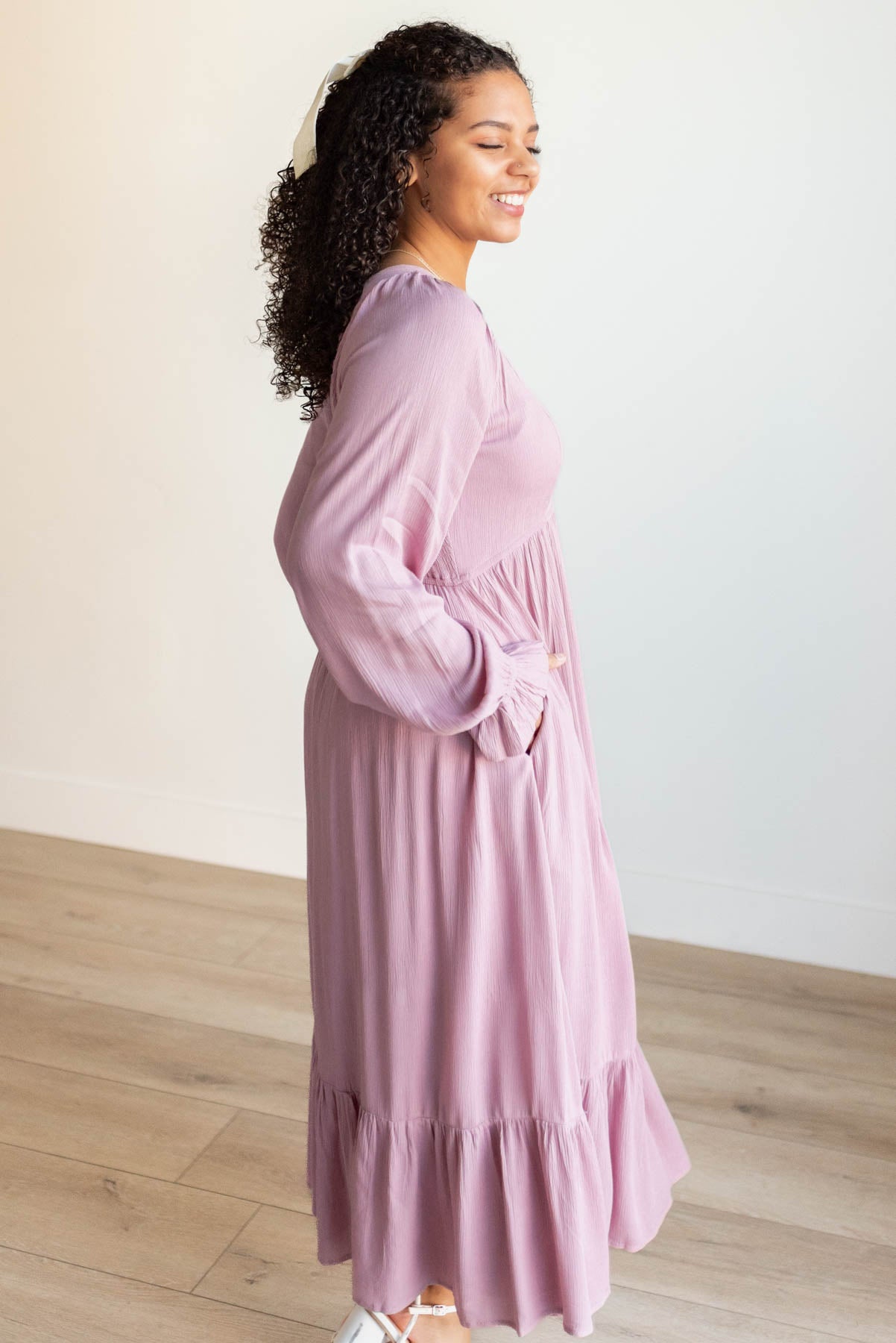 Side view of the mauve ruffle dress with pockets