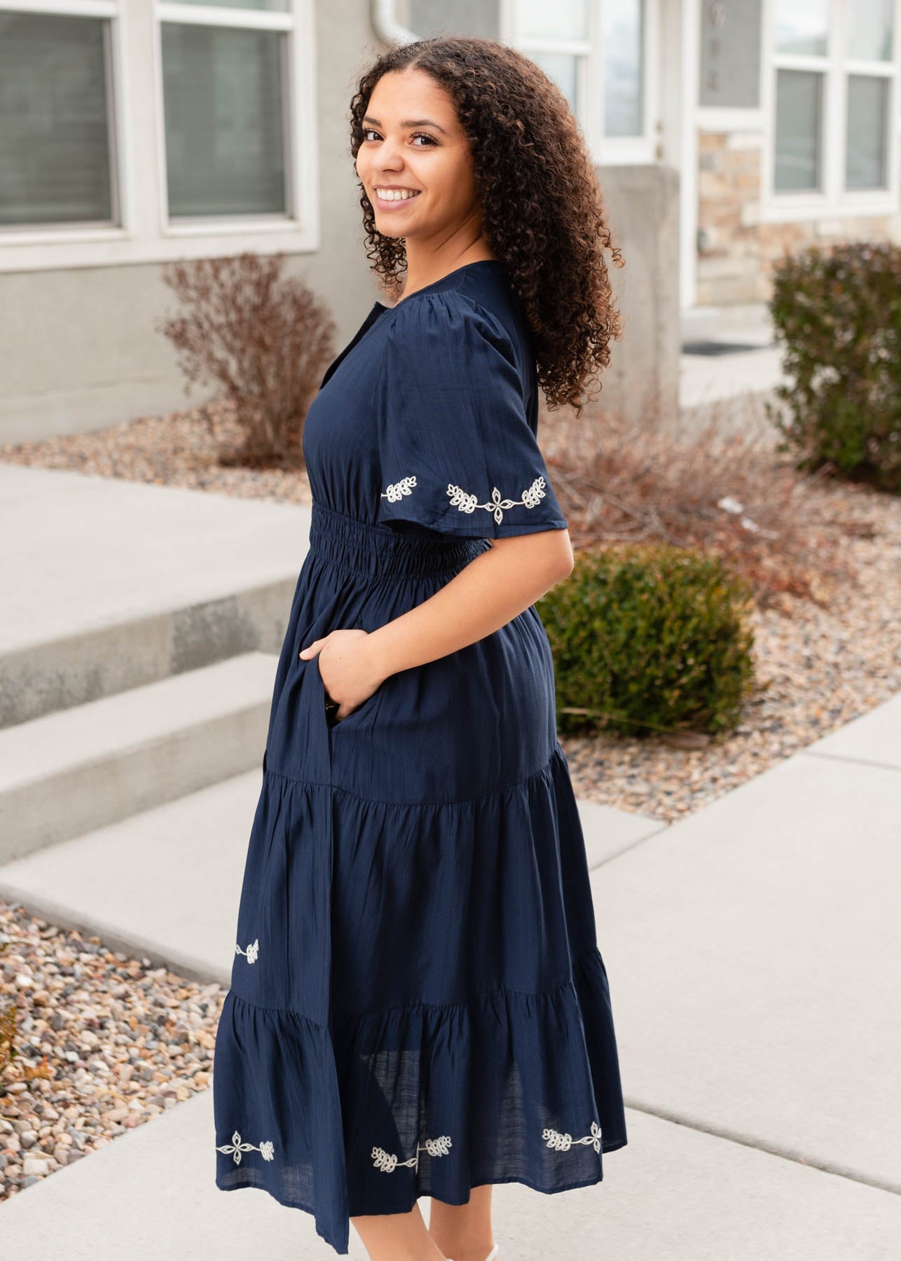 Side view of the midnight embroidered dress