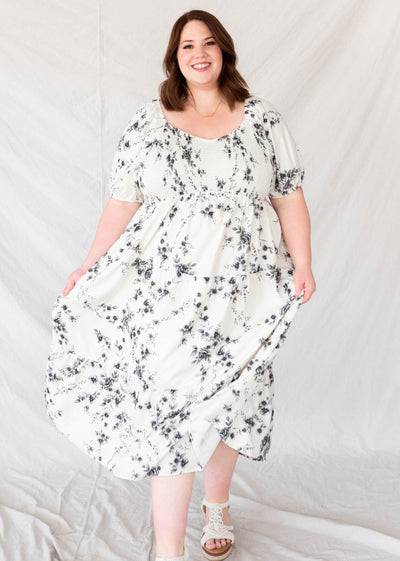 Wide v-neck on the plus size ivory floral tiered dress