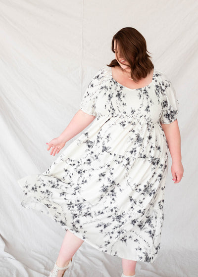 Plus size ivory floral tiered dress with short sleeves