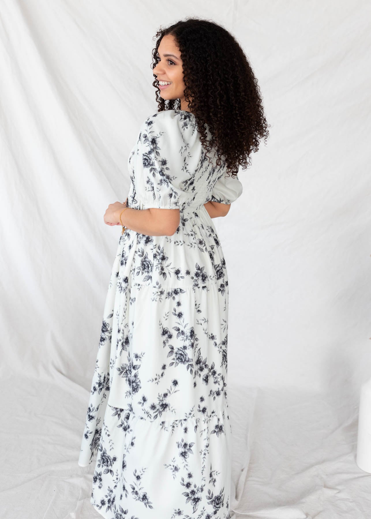 Side view of the ivory floral tiered dress